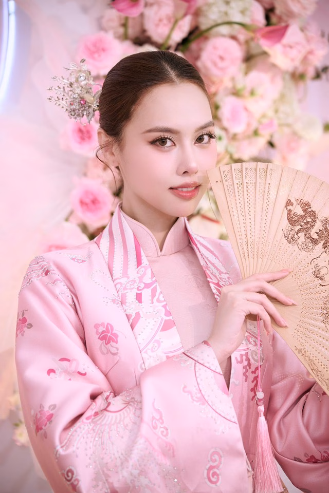 Á hậu Tâm Như duyên dáng trong tà áo dài hồng Á hậu Tâm Như đẹp dịu dàng trong lễ đính hôn - Ảnh 3.