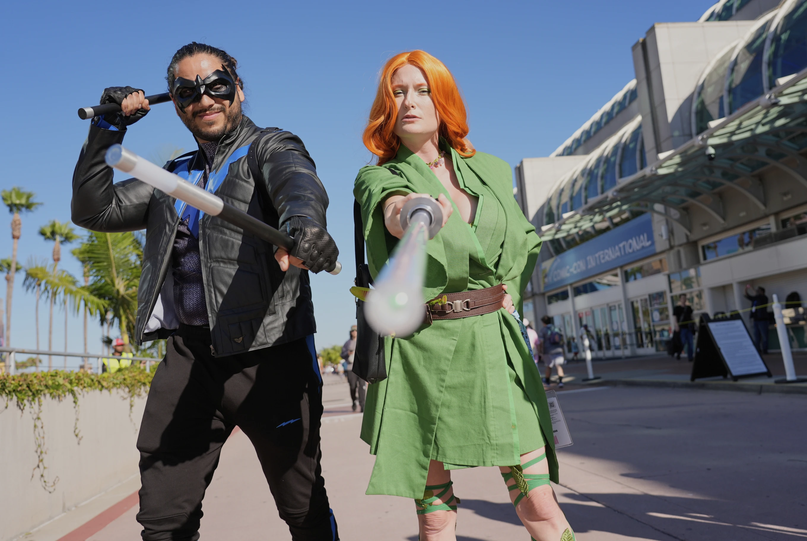 Ivan Martinez, left, dressed as “Nightwing,” and Jade Stone, dressed as “Poison Ivy Jedi,” pose for a photo before the 2025 Comic-Con International Preview Night on Wednesday, July 23, 2025, in San Diego. (AP Photo/Chris Pizzello)