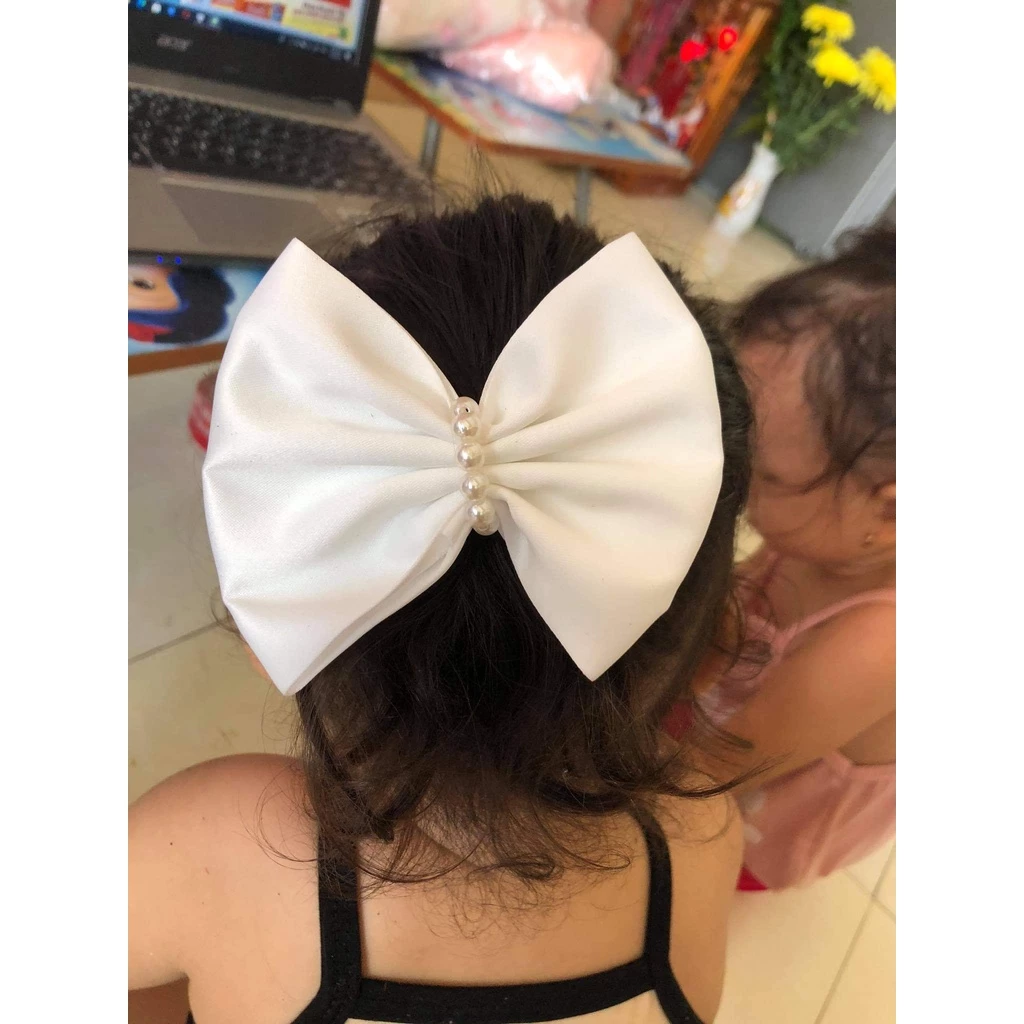 Làm thế nào để chọn cài nơ bé gái phù hợp với từng kiểu tóc?