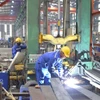 Cụm công nghiệp tại Hà Nội Hoạt động sản xuất tại một cụm công nghiệp trên địa bàn Hà Nội.