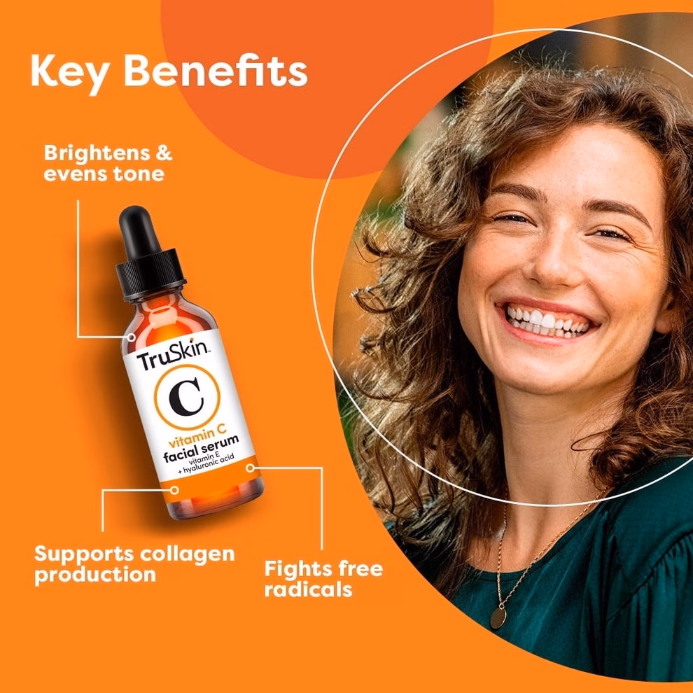 3 sản phẩm chăm sóc da và môi giúp giảm đỏ, làm mịn và cấp ẩm Smiling woman next to a TruSkin Vitamin C facial serum bottle. Text highlights benefits: brightens, evens tone, supports collagen, and fights free radicals