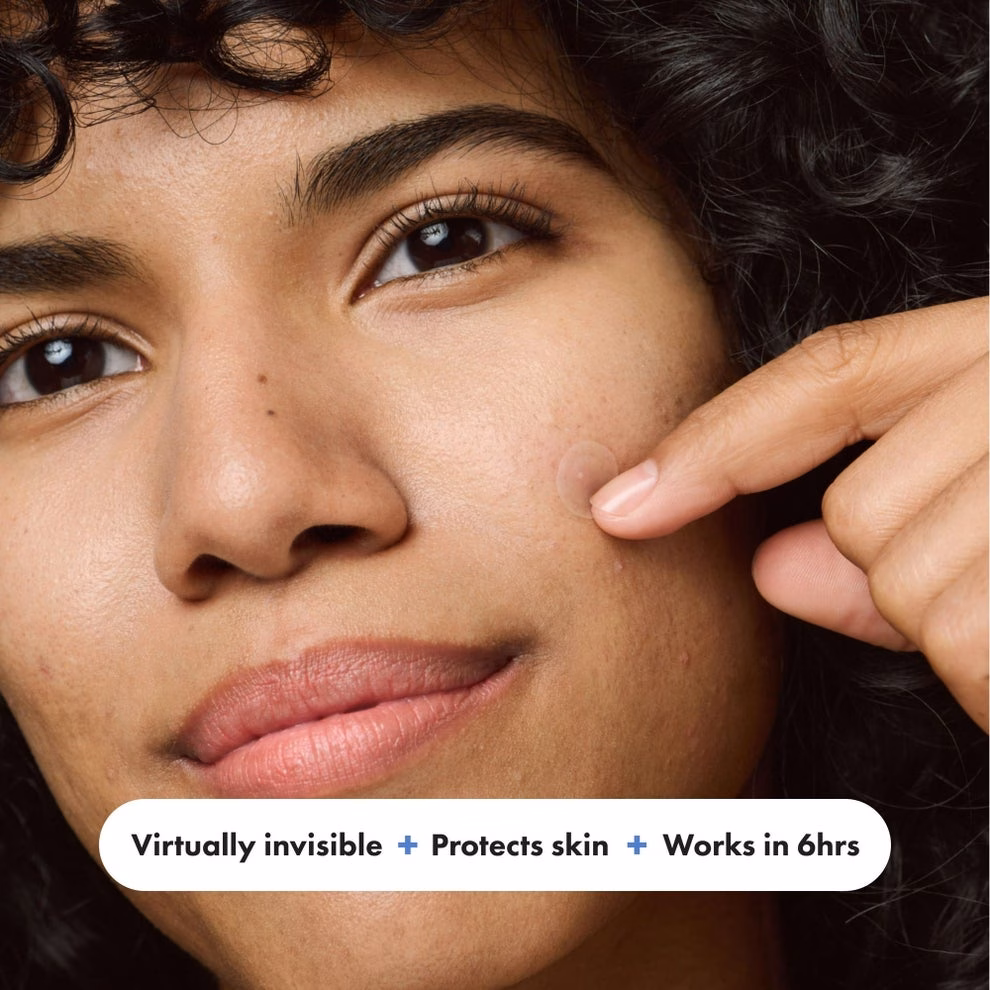 3 sản phẩm skincare giúp giảm đỏ mặt và làm dịu da nhạy cảm Person applies a nearly invisible skincare patch to cheek; text: "Virtually invisible + Protects skin + Works in 6hrs."