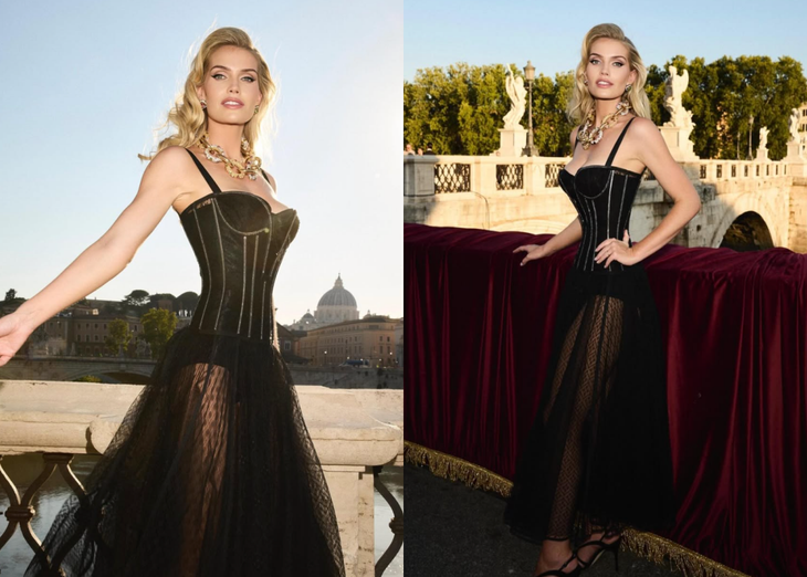 Kitty Spencer – Người mẫu quý tộc Anh với vẻ đẹp hoàng gia và phong cách thanh lịch Ngày 15-7, Kitty Spencer xuất hiện tại show diễn Alta Sartoria của Dolce & Gabbana tổ chức tại Castel Sant’Angelo, Rome. Với mái tóc vàng nổi bật, thần thái sang trọng và vẻ đẹp cổ điển, cô thu hút mọi ánh nhìn. Kitty diện bộ trang phục lấy cảm hứng từ nội y gồm váy đen xuyên thấu, vòng cổ xích vàng bản lớn và đôi giày cao gót đen. Tạp chí InStyle nhận định: "Sự kết hợp này khiến cô trông như một biểu tượng gợi cảm thời hiện đại" - Ảnh: IGNV