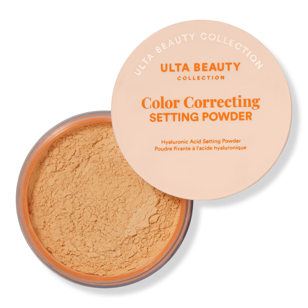 Ulta Beauty Color Correcting Setting Powder in an open container shows textured powder surface. Text highlights hyaluronic acid in formula