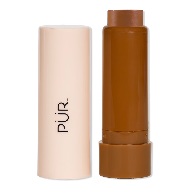PÜR cream foundation stick with a cap, suitable for easy application and blending. Ideal for achieving a smooth, even skin tone