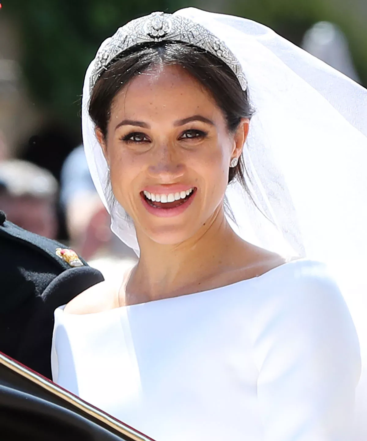 Prince Harry, Duke of Sussex and The Duchess of Sussex leave Windsor Castle in the Ascot Landau carriage during a procession after getting married at St Georges Chapel on May 19, 2018 in Windsor, England