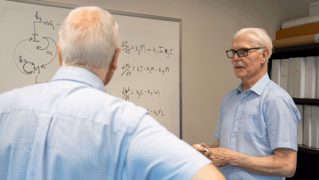“This may be the biological version of a blueprint,” said Bruce Boman, M.D., Ph.D. (right), with Gary Schleiniger.