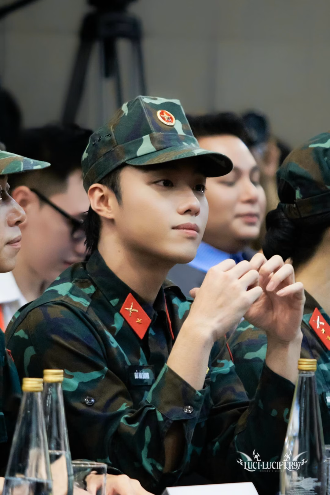May be an image of 2 people, hat, military uniform and text