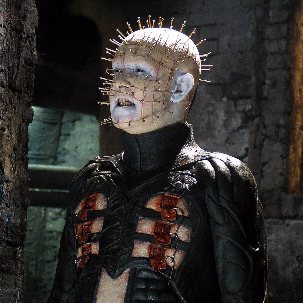 Character with a distinctive spiked head and dark attire