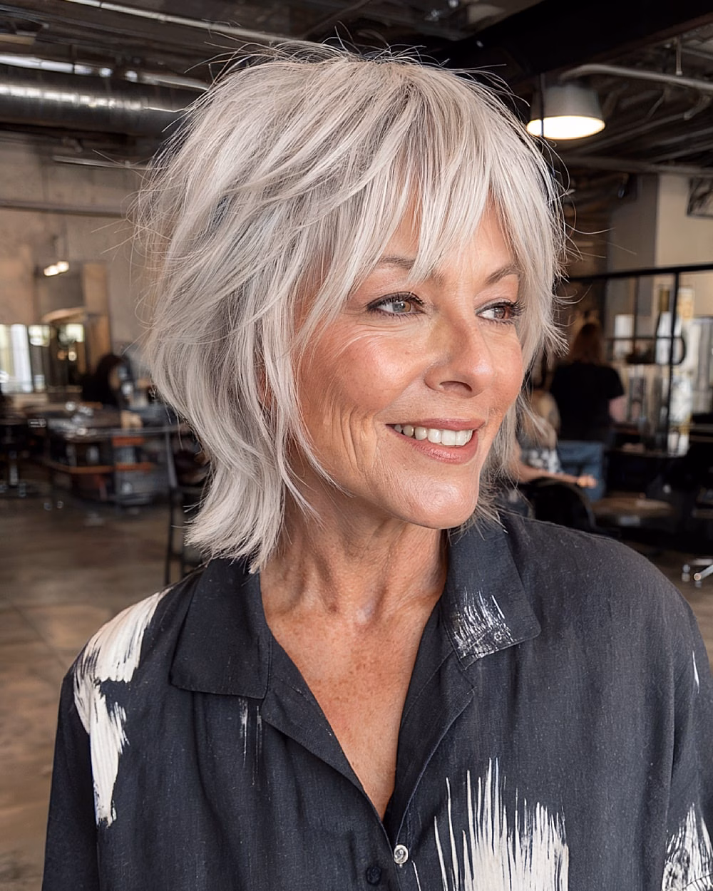 Cách chọn rèm mái phù hợp với phụ nữ trên 70 tuổi Choppy silver wolf cut with curtain bangs for textured edgy finish on women over 70