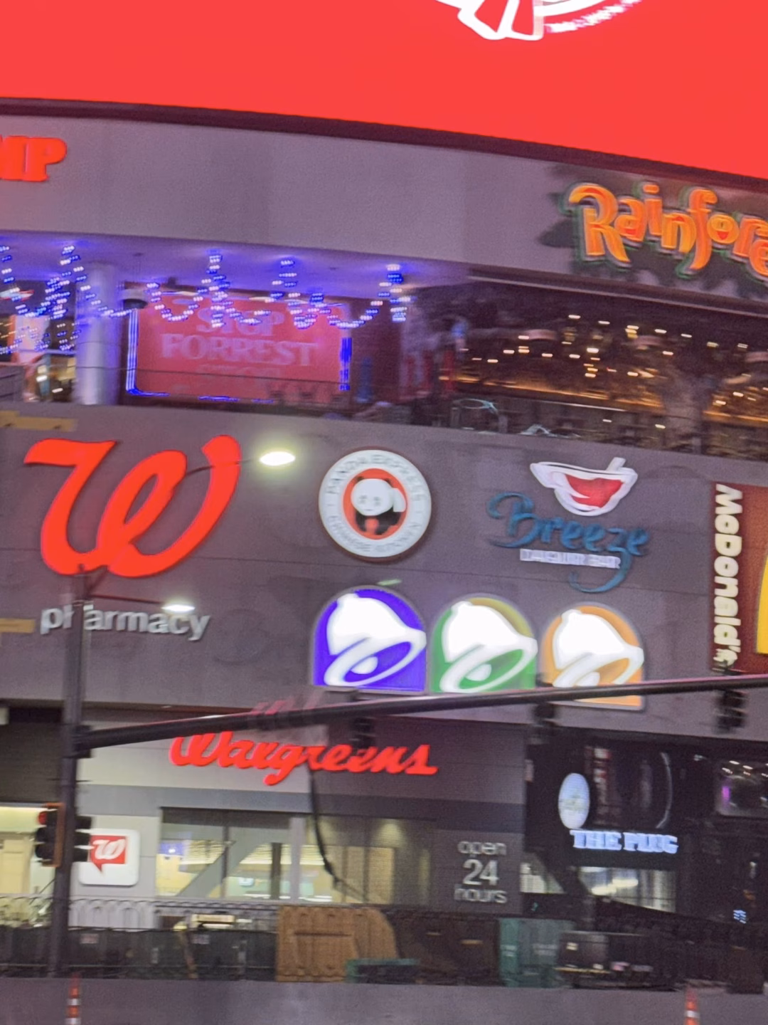 May be an image of ‎signboard and ‎text that says '‎IP FORREST Rainfor שך Dreeze OS pt pr armacy armacy 200 ANna WлK4 1:E THEPUIG TUEC ocen 24 hours noUrS‎'‎‎