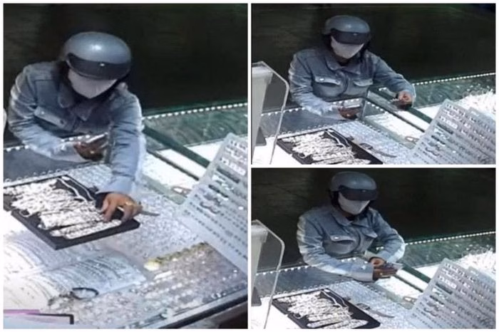 Phụ nữ mặc &aacute;o kho&aacute;c jean xanh d&ugrave;ng điện thoại che mắt khi trộm lắc tay v&agrave;ng tại chợ An Đ&ocirc;ng