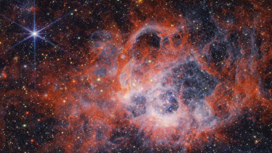 This image from NASA’s James Webb Space Telescope’s NIRCam (Near-Infrared Camera) of star-forming region NGC 604 shows how stellar winds from bright, hot young stars carve out cavities in surrounding gas and dust. But why do some galaxies abruptly put star formation on pause?
