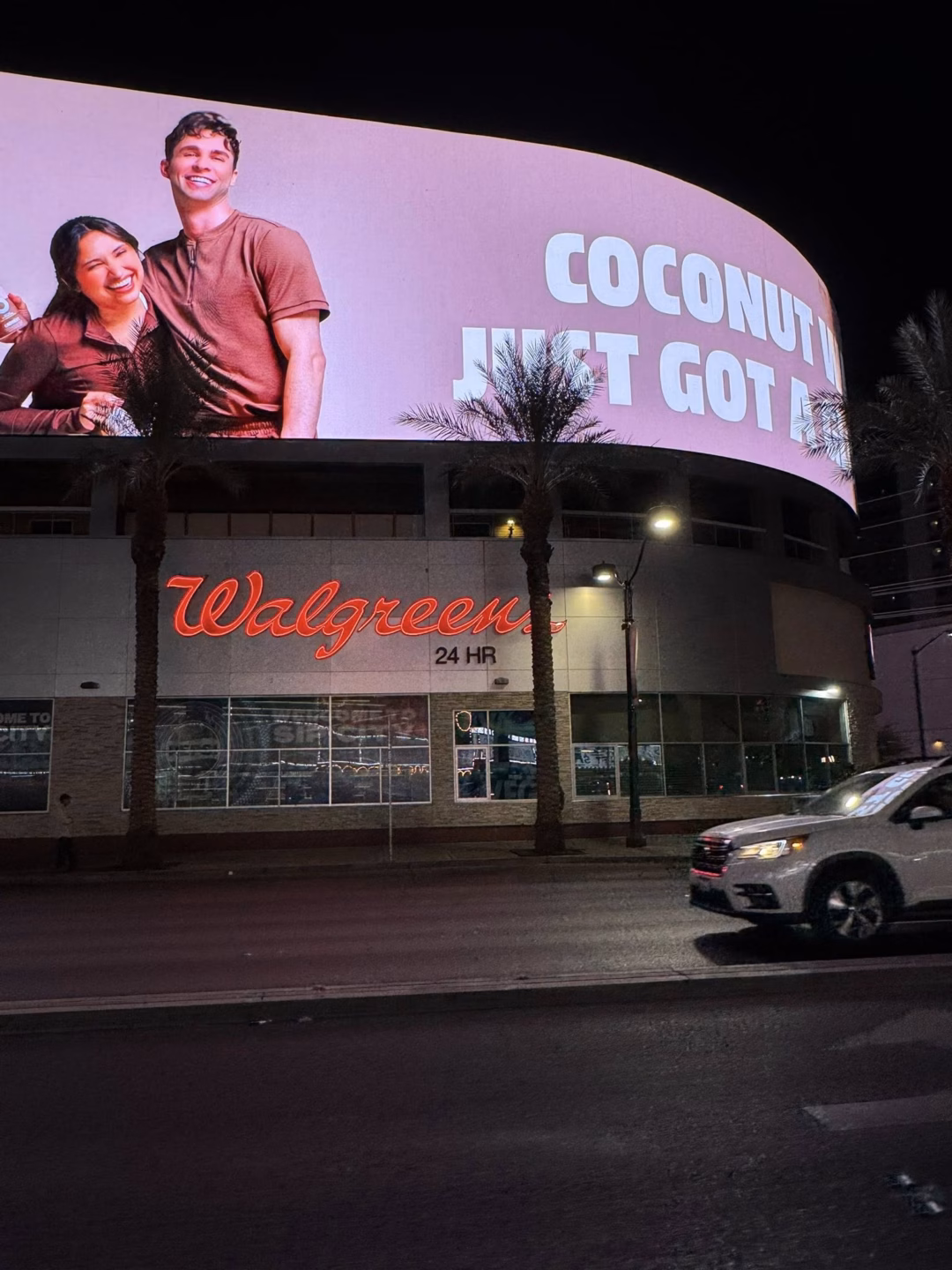Đoàn ca sĩ ăn 48 bánh Karo trong 10 phút, fan đội mưa xếp hàng mua Karo May be an image of 2 people, signboard and text that says 'COCONUT ЛИET GOT Walgreen'