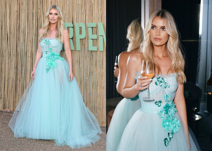 Người mẫu Kitty Spencer: Nhan sắc quý tộc và phong cách hoàng gia của cháu gái Công nương Diana Tại bữa tiệc mùa hè thường niên do Serpentine Gallery tổ chức ở London vào ngày 24-6, Kitty Spencer hóa “Lọ Lem thời hiện đại”. Chiếc váy tulle không tay, với phần corset ôm sát, tôn vinh vóc dáng thanh thoát của cô. Eo váy được siết nhẹ bằng một đai liền thân, thả xuống phần chân váy phồng bồng bềnh như mây, đính hoa lụa xanh ngọc và pha lê lấp lánh. Cô hoàn thiện vẻ ngoài vương giả bằng hoa tai kim cương và nhẫn đính hôn - Ảnh: IGNV
